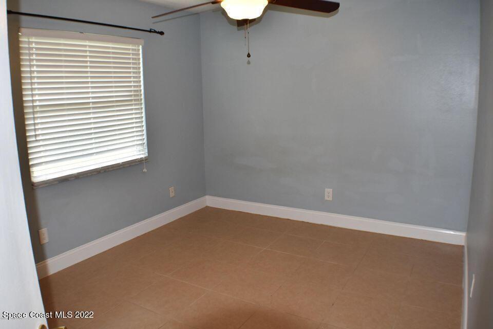 3335 Jay Tee Drive Melbourne, FL 32901 - Photo 19 of 37 a view of an empty room with a window