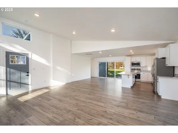 a kitchen with appliances cabinets and a sink