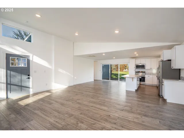 a kitchen with appliances cabinets and a sink