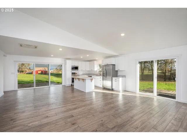 a bathroom with a sink a mirror and shower
