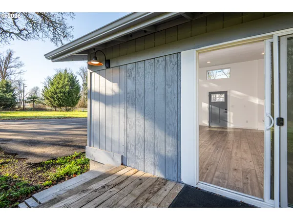 a view of a backyard with swimming pool