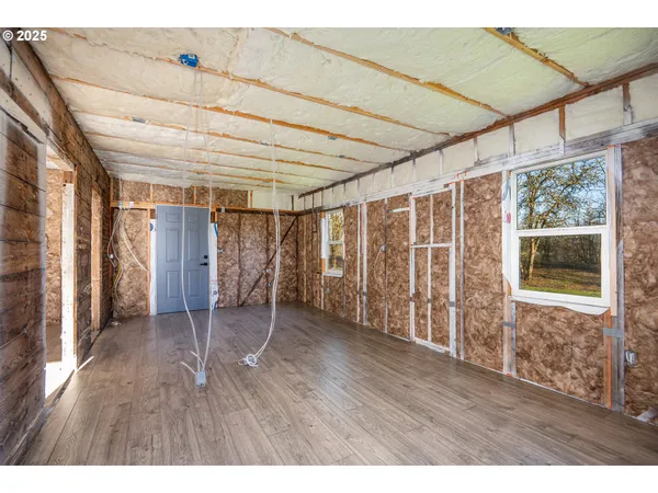 a view of a room with wooden walls