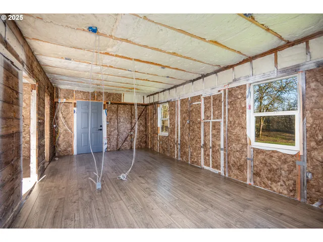 a view of a room with wooden walls