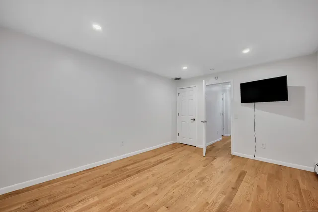 a view of a livingroom with wooden floor