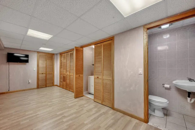 a bathroom with a toilet sink and shower