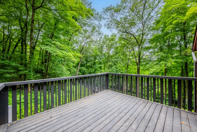 a view of balcony with wooden floor
