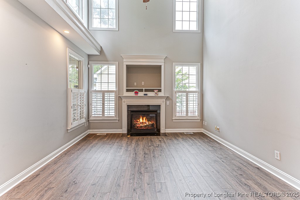 367 Falling Water Road Spring Lake, NC 28390 - Photo 11 of 41 an empty room with windows and fireplace