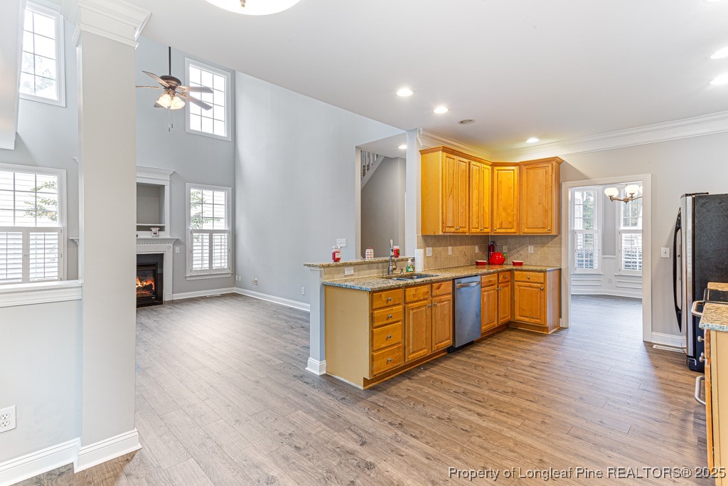 367 Falling Water Road Spring Lake, NC 28390 - Photo 15 of 41 a large kitchen with a center island wooden floor and stainless steel appliances