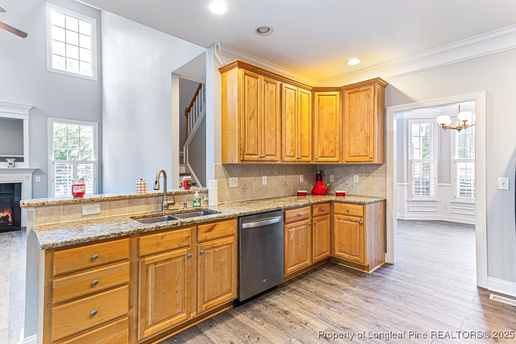 367 Falling Water Road Spring Lake, NC 28390 - Photo 17 of 41 a kitchen with stainless steel appliances sink cabinets and a large window