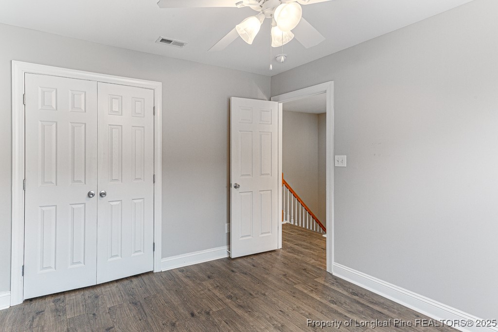 367 Falling Water Road Spring Lake, NC 28390 - Photo 22 of 41 a view of an empty room with wooden floor