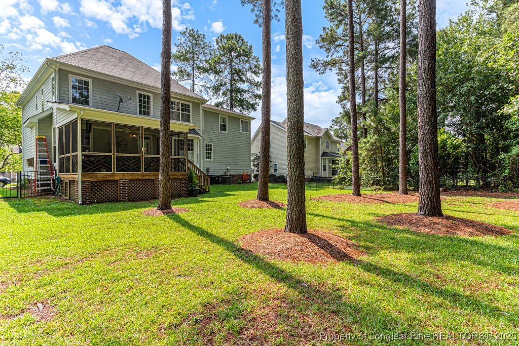367 Falling Water Road Spring Lake, NC 28390 - Photo 39 of 41 a view of a house with a backyard and a large tree