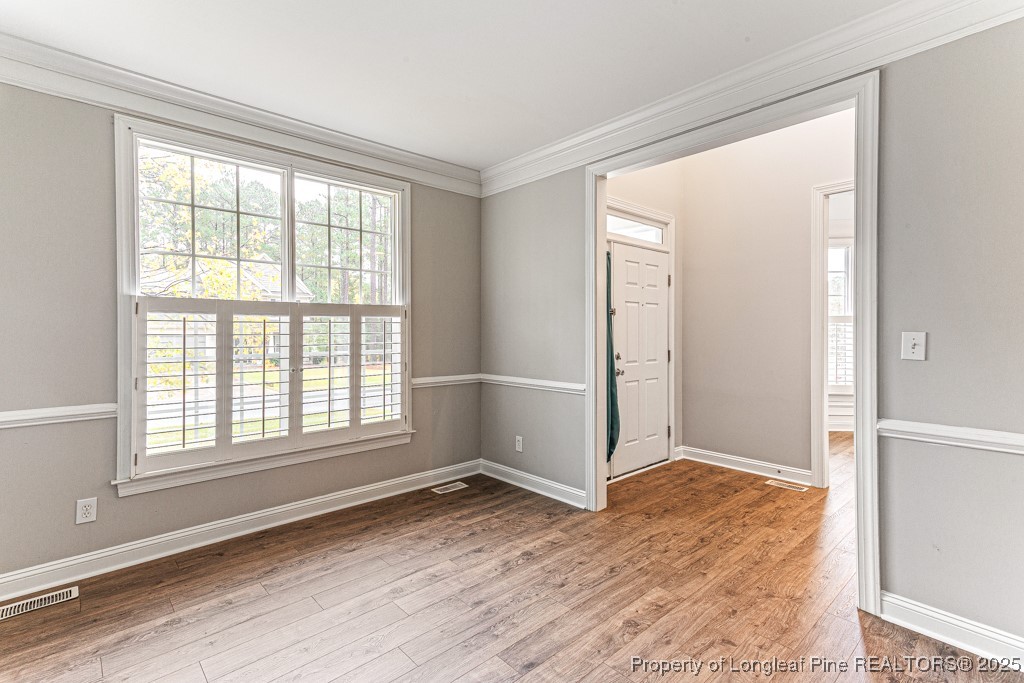 367 Falling Water Road Spring Lake, NC 28390 - Photo 6 of 41 an empty room with wooden floor and windows