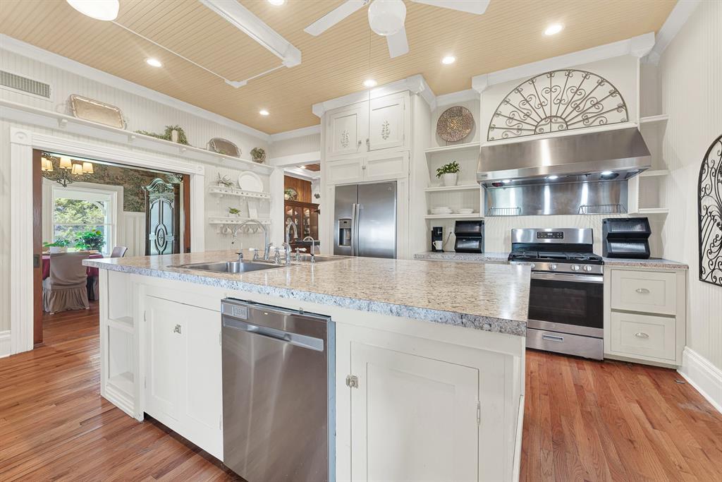 1425 Lone Star Road Celina, TX 75009 - Photo 2 of 40 Step inside through the everyday entrance, where modern kitchen updates blend beautifully with the timeless Victorian character that makes this home so welcoming. Imagine family and friends naturally gathering here, lingering over conversations before drifting into the dining room or out to the wraparound porch.