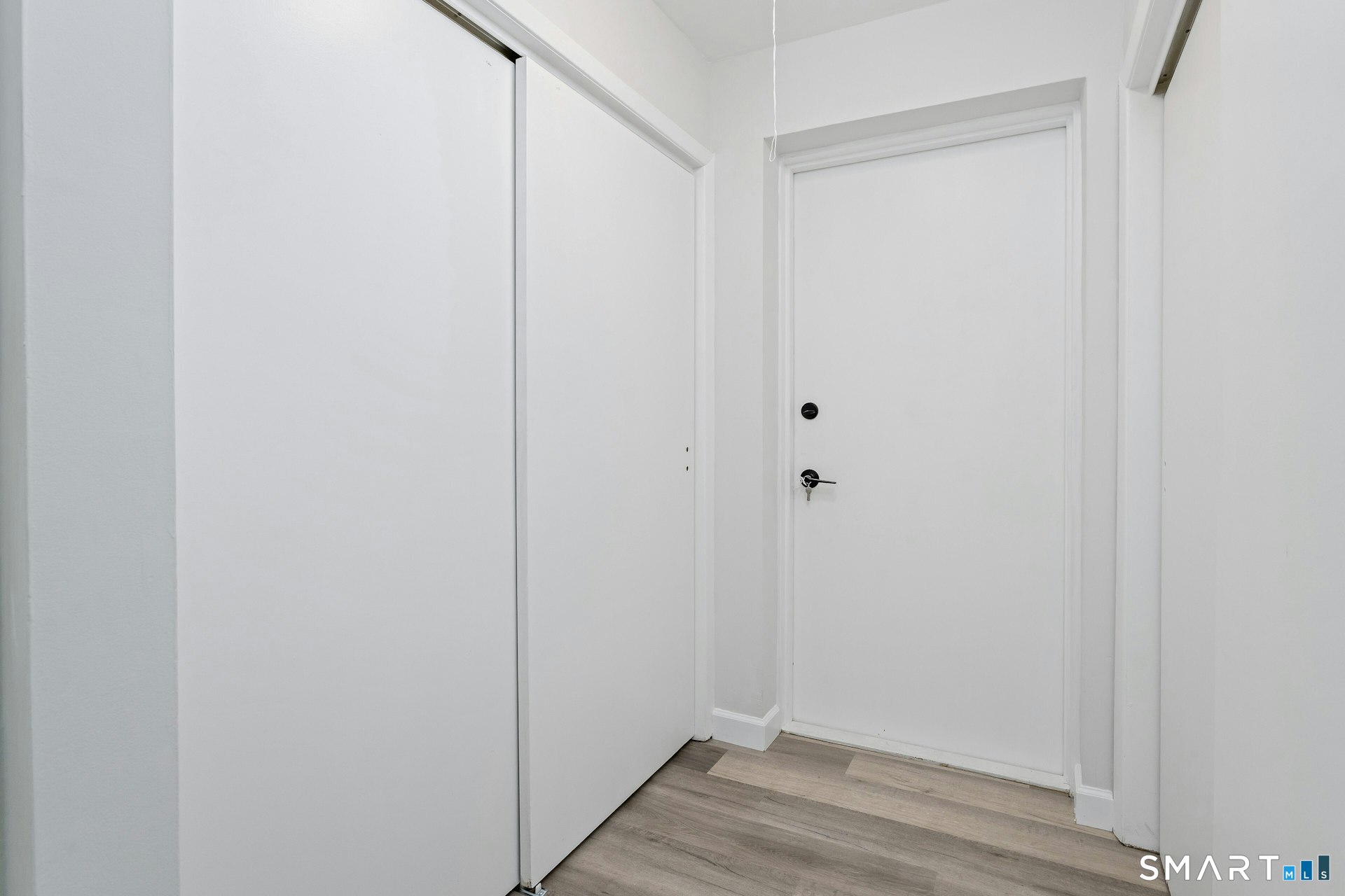 154 Cold Spring Road, Unit 18 Stamford, CT 06905 - Photo 22 of 28 a view of small space with wooden floor