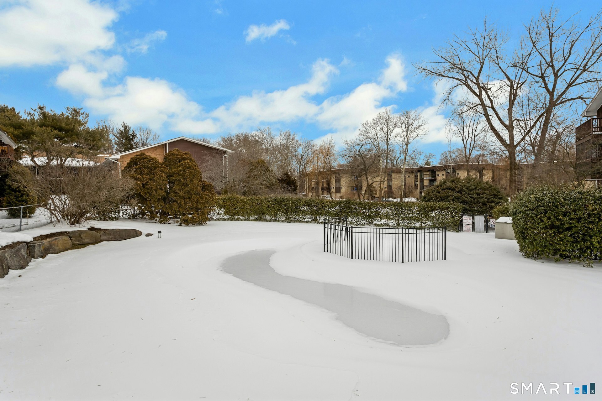 154 Cold Spring Road, Unit 18 Stamford, CT 06905 - Photo 28 of 28 a view of house with snow and yard