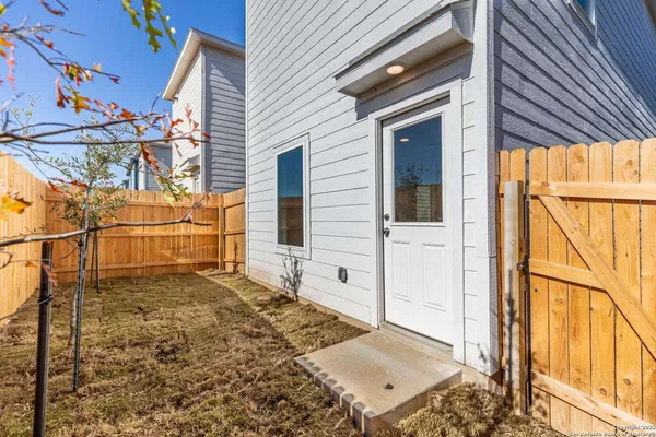 a view of a house with a backyard