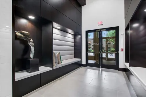 a spacious bathroom with a double vanity sink and a mirror