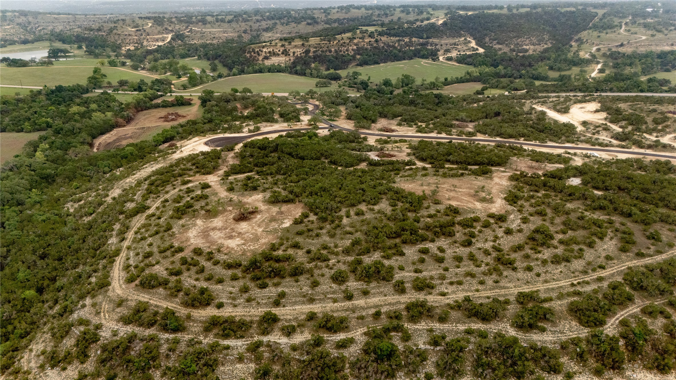 Lot 23 Ranch Road 165 Dripping Springs, TX 78620 - Photo 7 of 12 an aerial view of residential houses with outdoor space