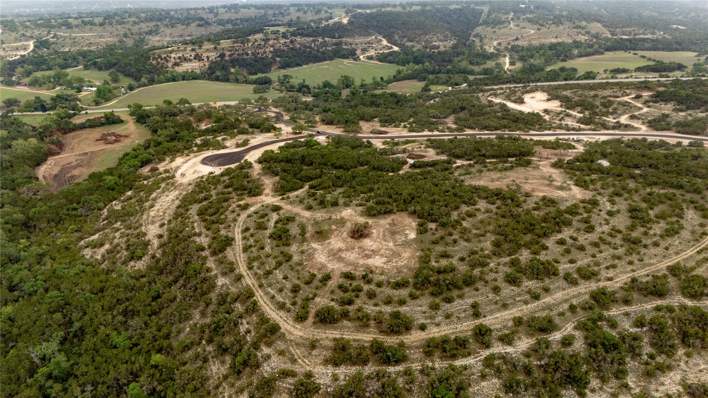 Lot 23 Ranch Road 165 Dripping Springs, TX 78620 - Photo 8 of 12 an aerial view of residential houses with yard