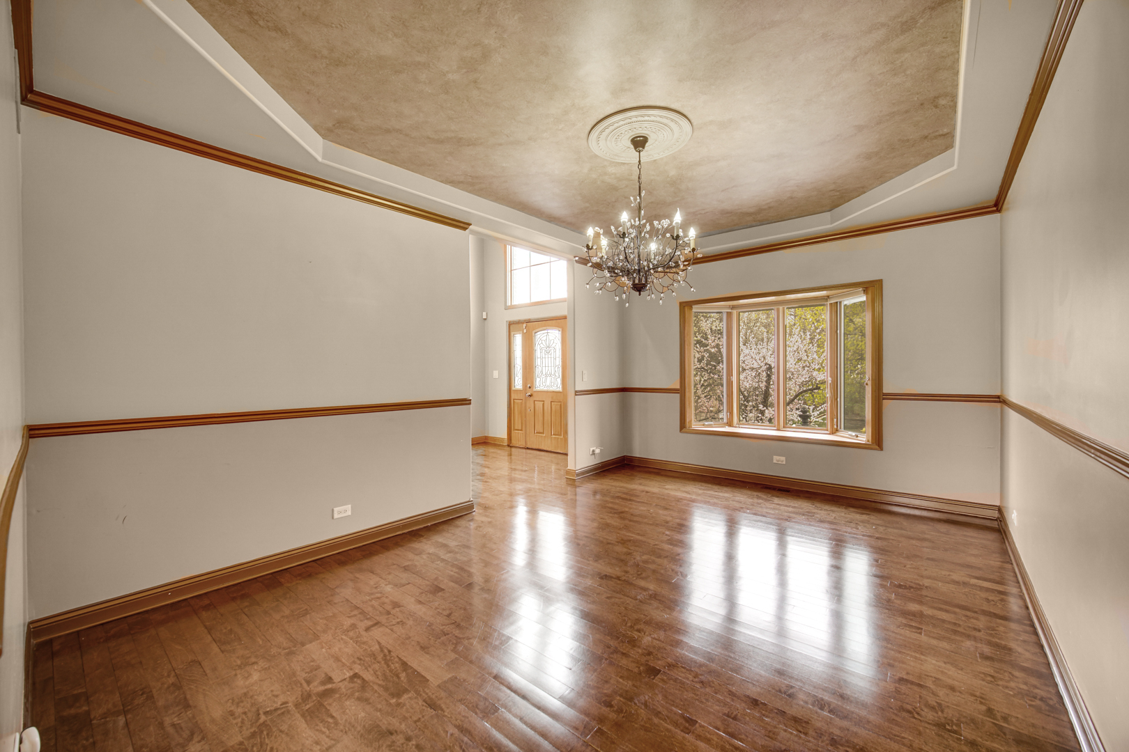 441 Delaware Circle Bolingbrook, IL 60440 - Photo 18 of 69 a view of a room with wooden floor and chandelier