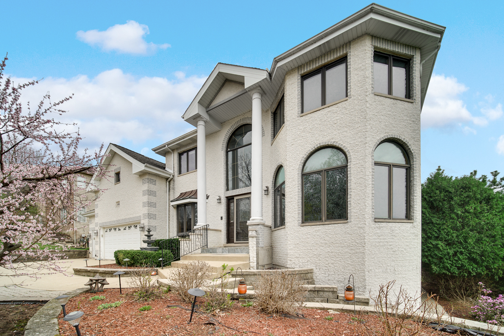 441 Delaware Circle Bolingbrook, IL 60440 - Photo 2 of 69 a front view of a house with garden