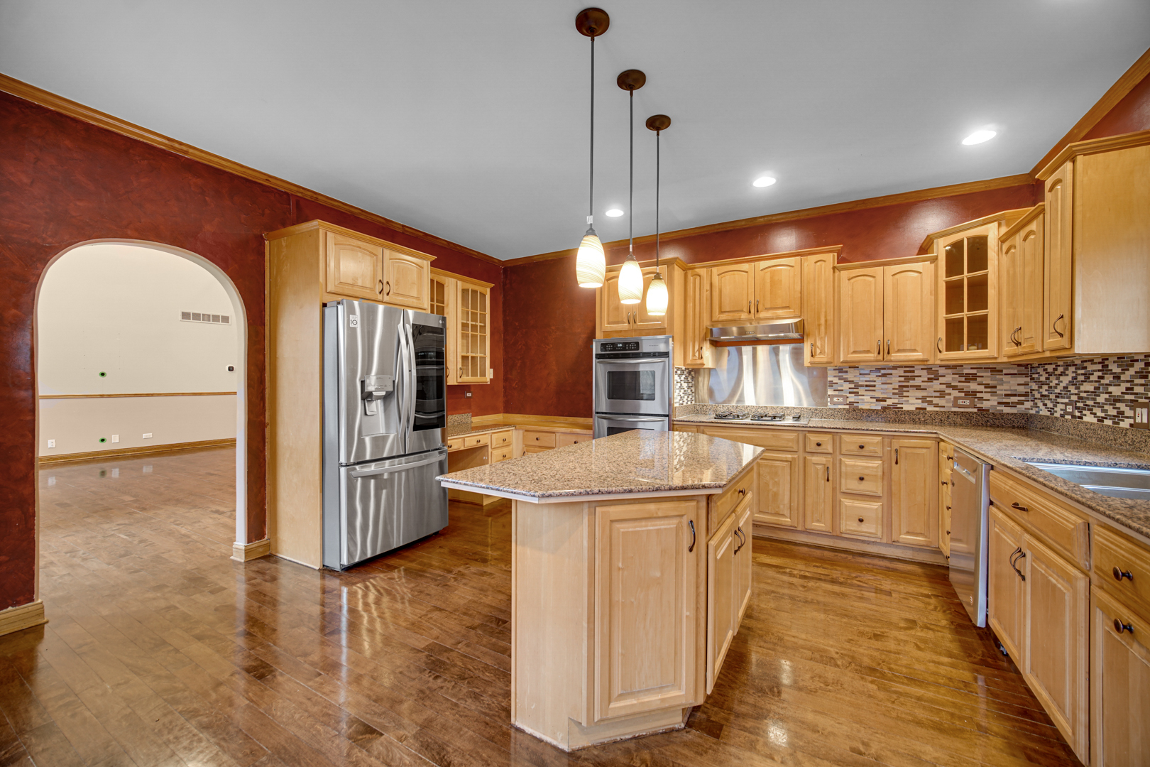 441 Delaware Circle Bolingbrook, IL 60440 - Photo 24 of 69 a kitchen with stainless steel appliances granite countertop a sink a stove and a refrigerator