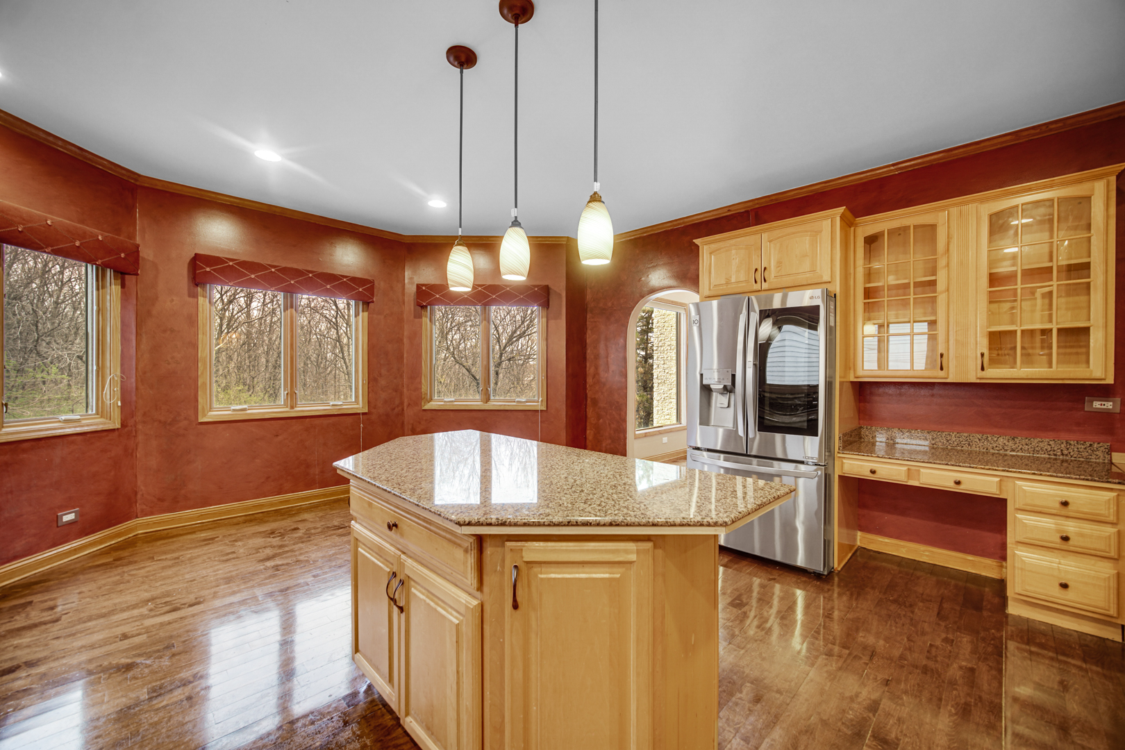 441 Delaware Circle Bolingbrook, IL 60440 - Photo 26 of 69 a kitchen with stainless steel appliances granite countertop a sink a stove and a wooden floors