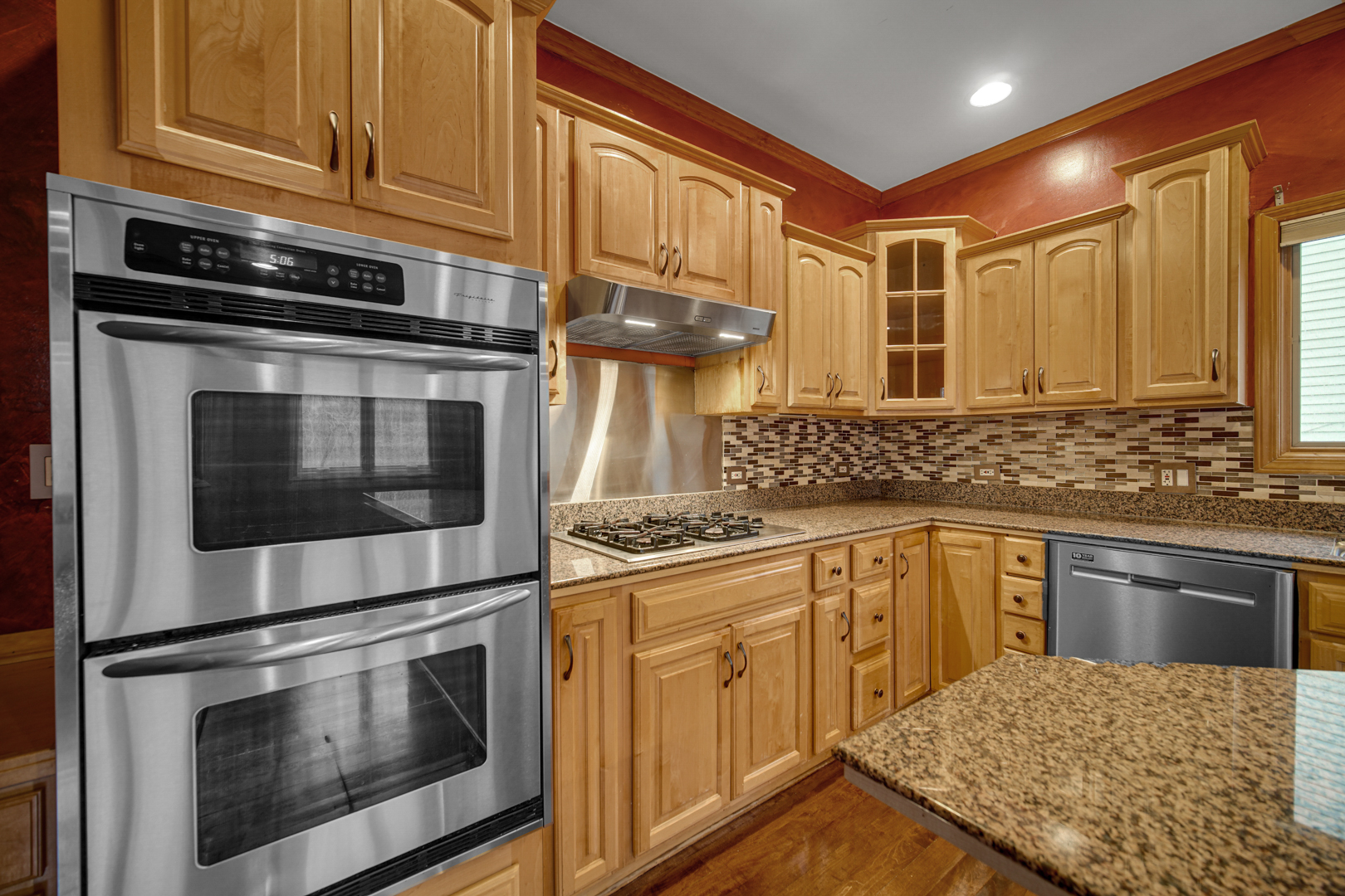441 Delaware Circle Bolingbrook, IL 60440 - Photo 27 of 69 a kitchen with stainless steel appliances granite countertop a stove and cabinets