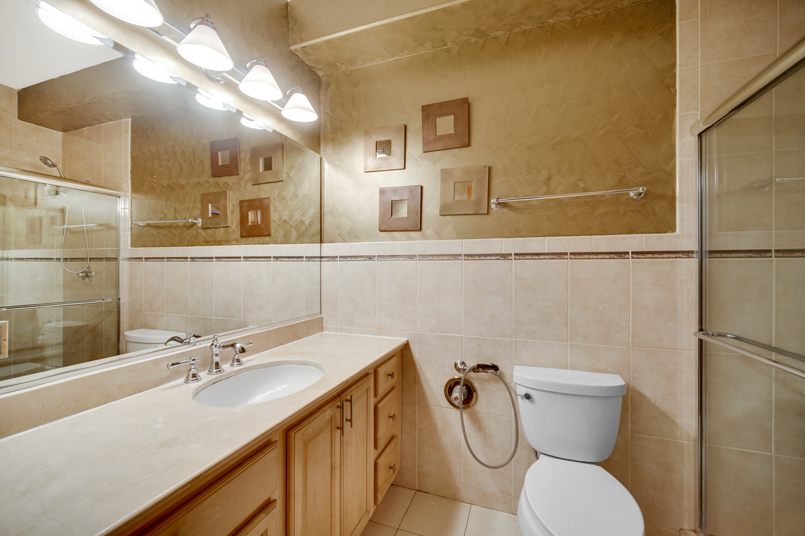 441 Delaware Circle Bolingbrook, IL 60440 - Photo 32 of 69 a bathroom with a sink a toilet and mirror