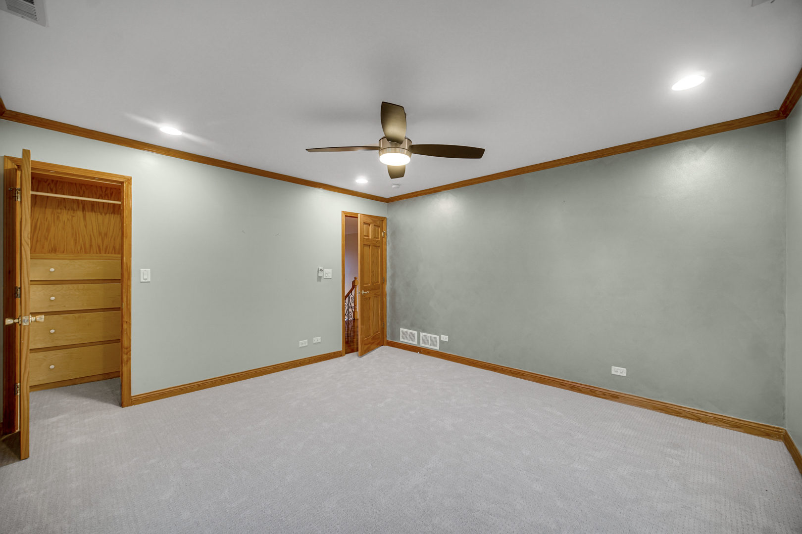 441 Delaware Circle Bolingbrook, IL 60440 - Photo 49 of 69 an empty room with closet and a ceiling fan