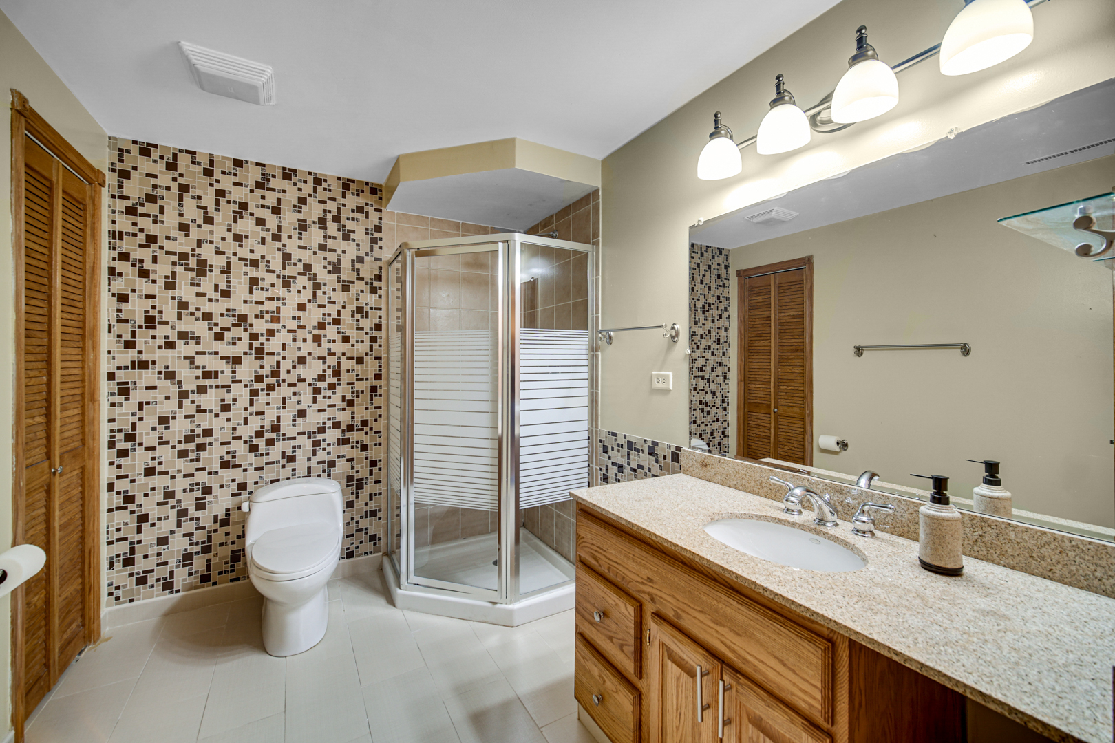 441 Delaware Circle Bolingbrook, IL 60440 - Photo 52 of 69 a bathroom with a sink toilet and shower