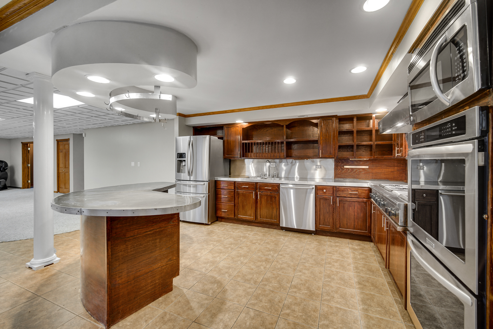 441 Delaware Circle Bolingbrook, IL 60440 - Photo 56 of 69 a kitchen with stainless steel appliances granite countertop a large counter top and stove