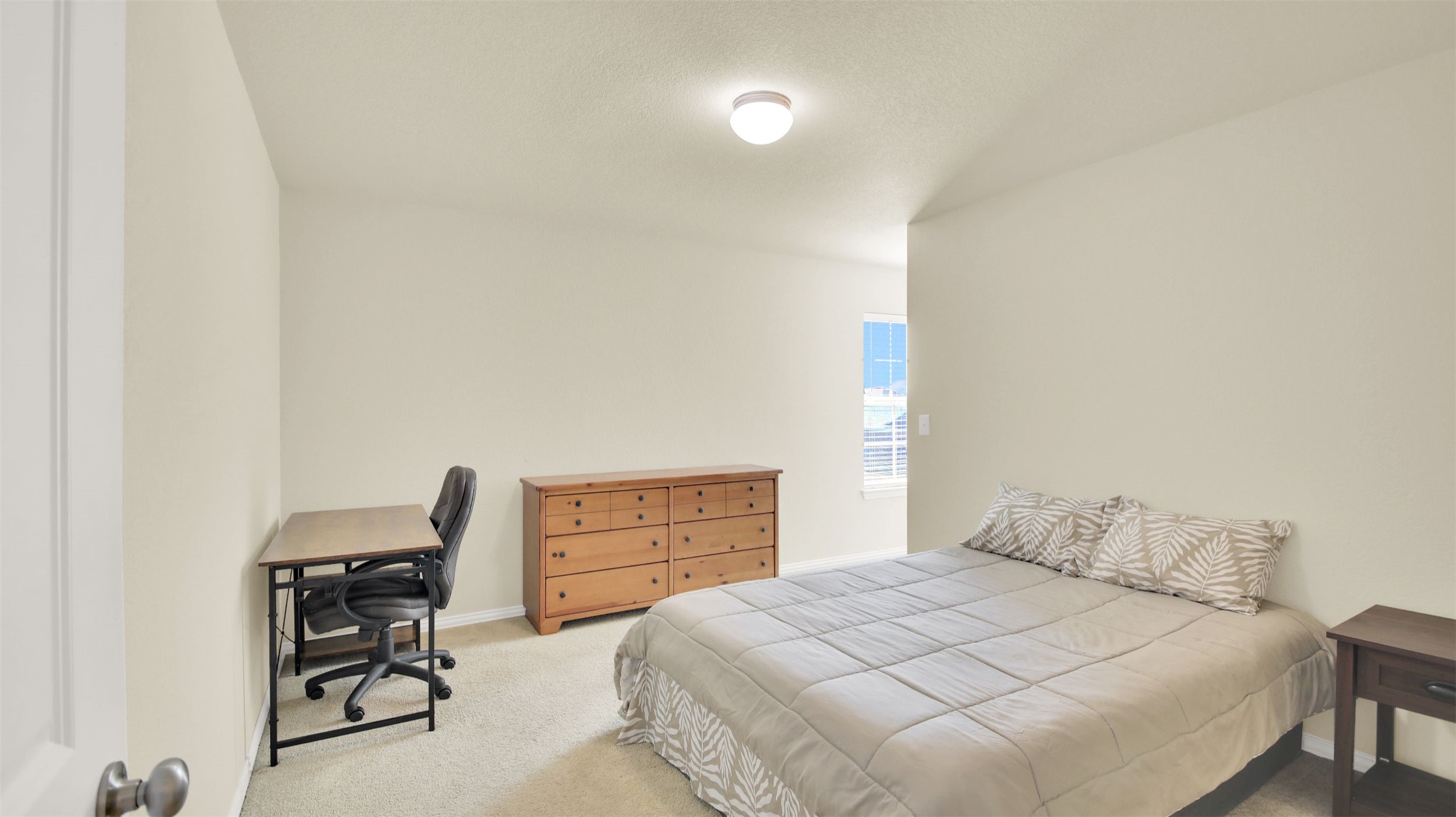 13716 Sugar Bush Path Manor, TX 78653 - Photo 29 of 37 Bedroom with light colored carpet and a desk