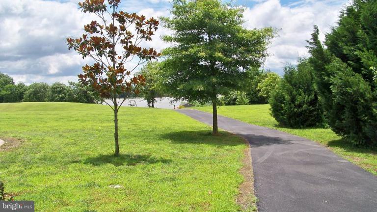 3411 Soper Road Huntingtown, MD 20639 - Photo 3 of 28 a view of a tree in a park