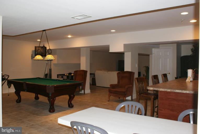 3411 Soper Road Huntingtown, MD 20639 - Photo 28 of 28 a living room with furniture and a table