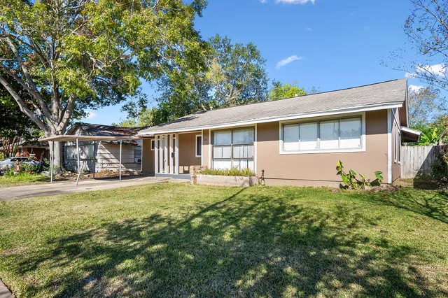 front view of a house with a big yard