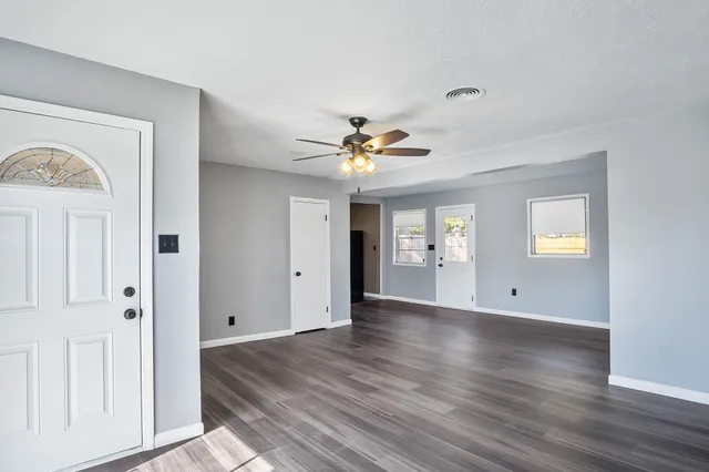 a view of an empty room with a window