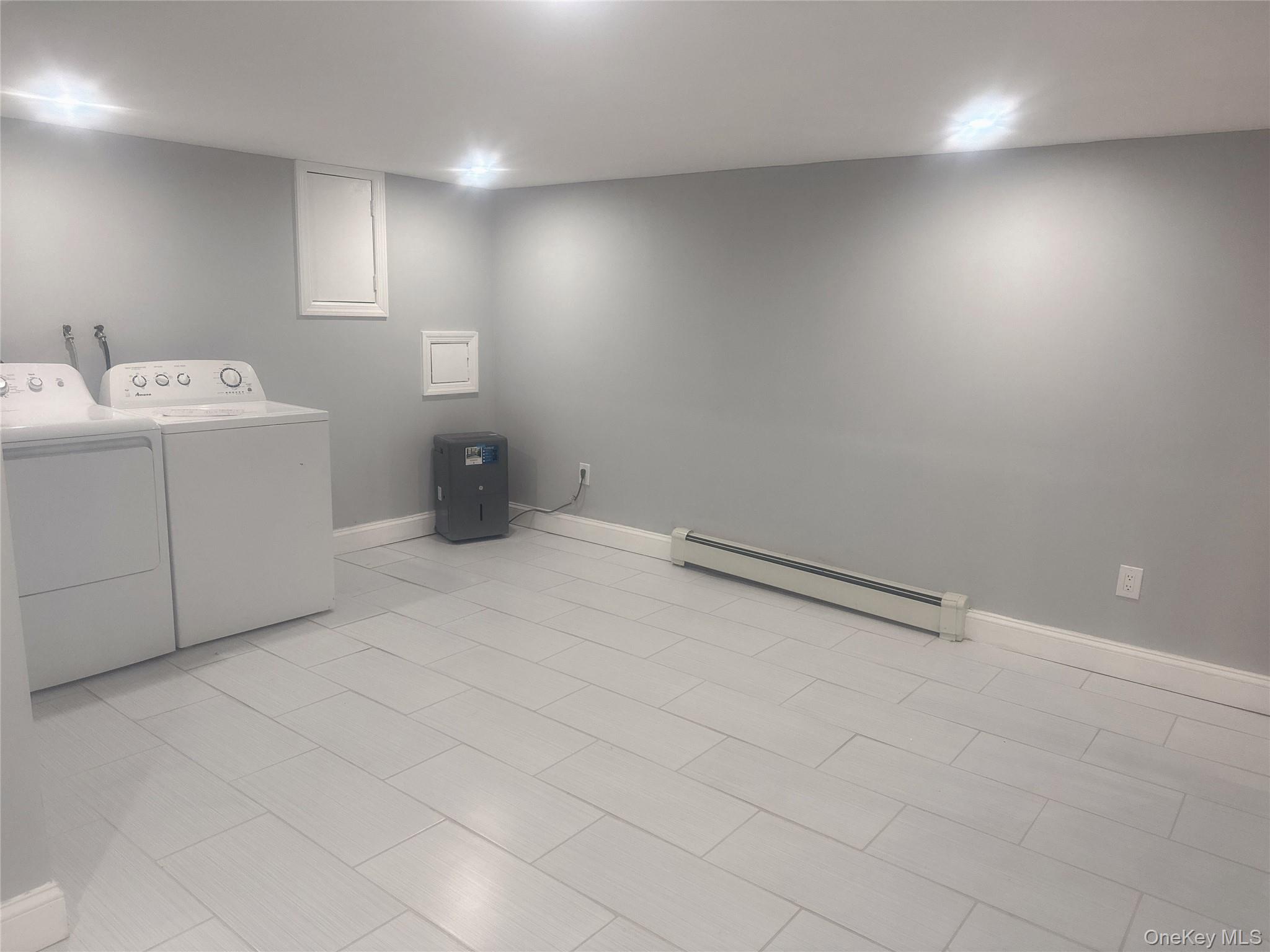 2573 Legion Street Bellmore, NY 11710 - Photo 2 of 13 a bathroom with a sink toilet and vanity