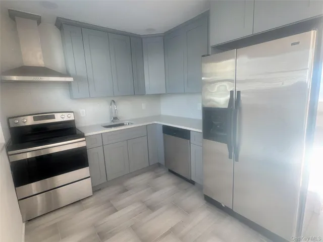 a kitchen with a sink and white cabinets