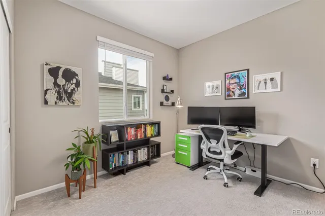 a view of a workspace with a window and couch