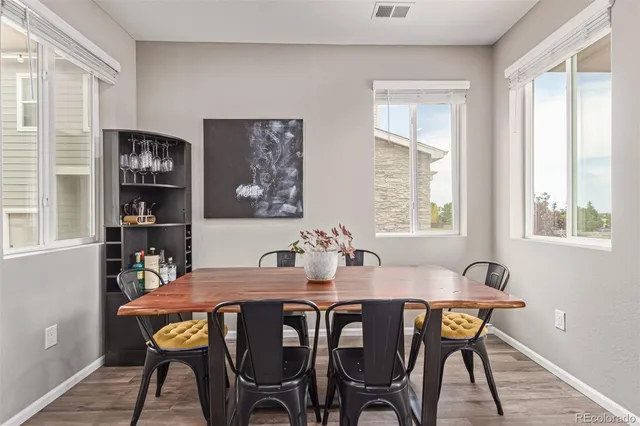 a view of a dining room with furniture and window