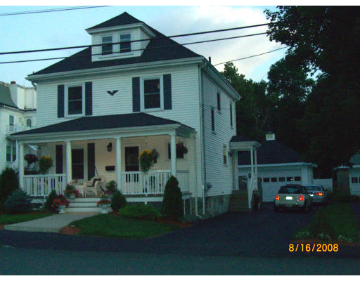 6 Middlesex Avenue Reading, MA 01867 - Photo 1 of 9 a front view of a house with a garden