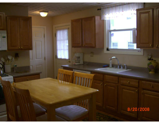 6 Middlesex Avenue Reading, MA 01867 - Photo 5 of 9 a kitchen with cabinets a sink stainless steel appliances and window