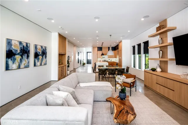 a spacious bedroom with a bed and a window