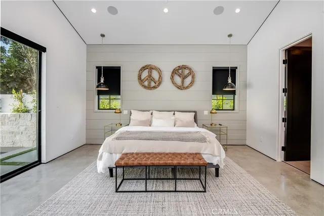 a view of a lake with couches in the patio