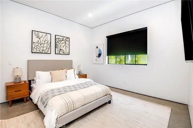 a view of a hallway with a view of living room