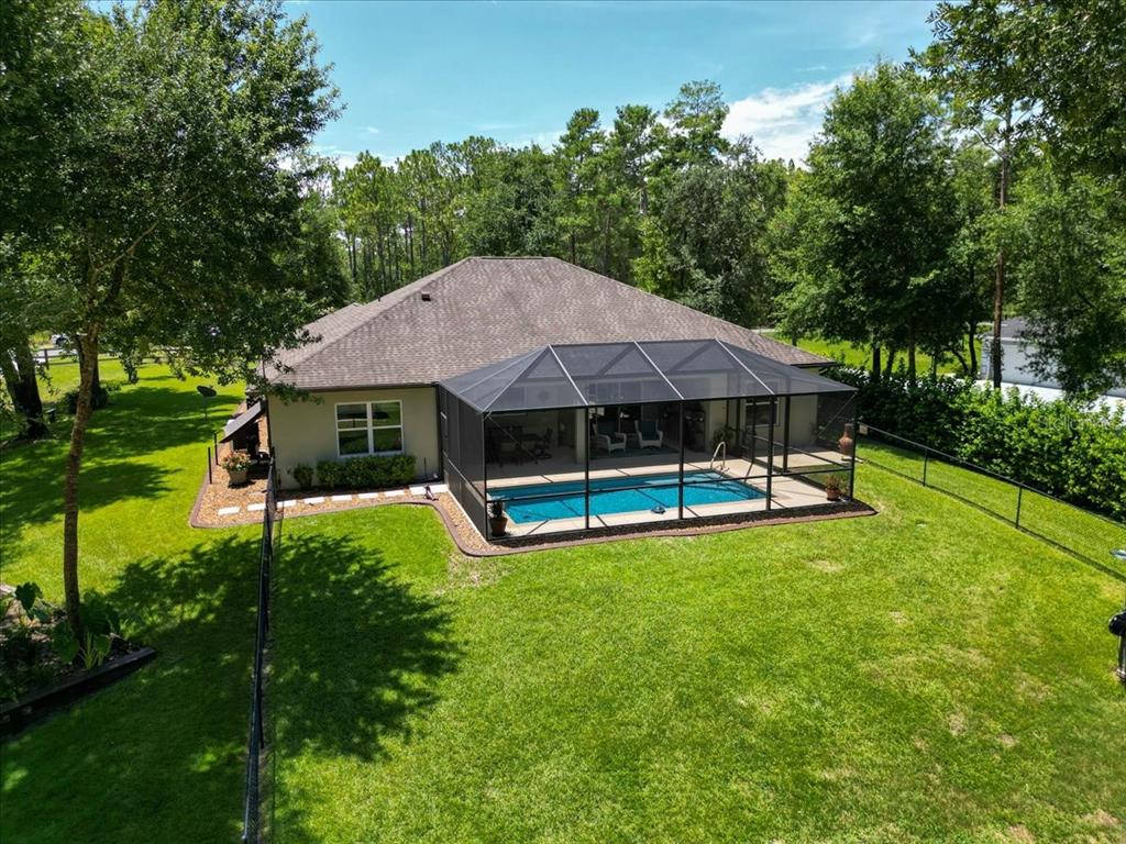 4359 Southwest 117th Place Ocala, FL 34476 - Photo 54 of 58 a view of a house with a yard porch and sitting area