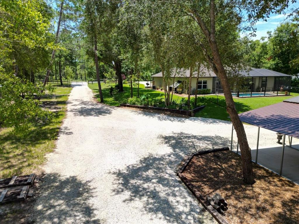 4359 Southwest 117th Place Ocala, FL 34476 - Photo 58 of 58 a front view of a house with garden