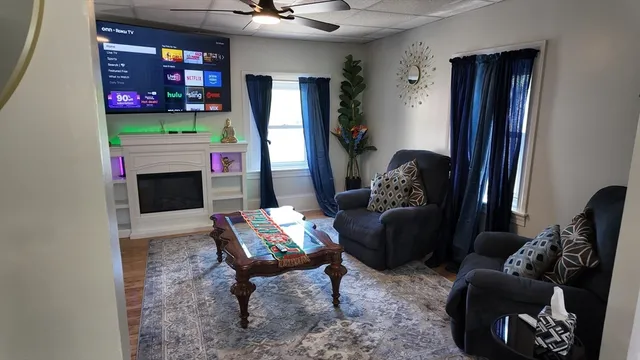 a living room with furniture and a fireplace