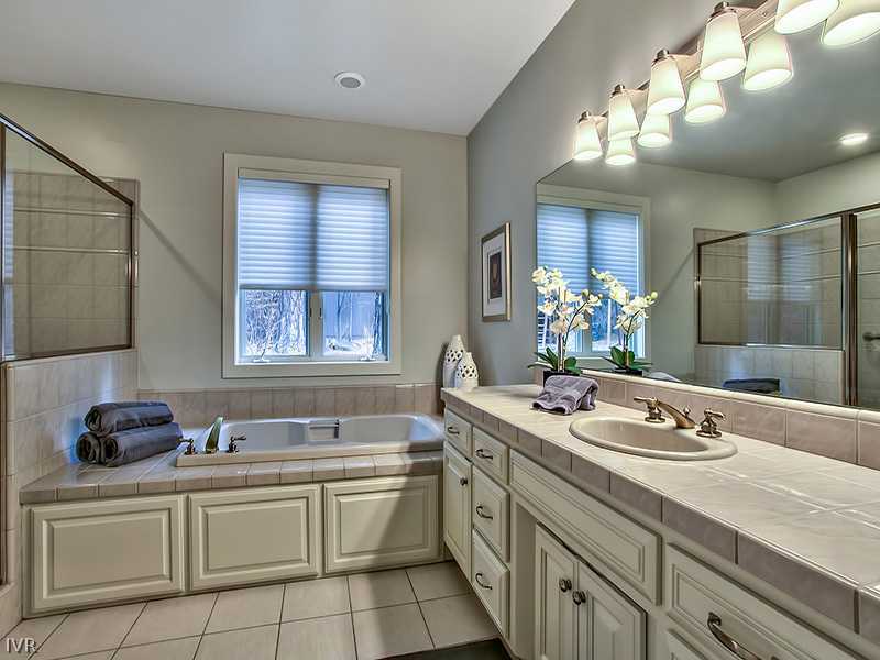 818 Ophir Peak Road Incline Village, NV 89451 - Photo 21 of 31 a bathroom with a sink double vanity and a mirror